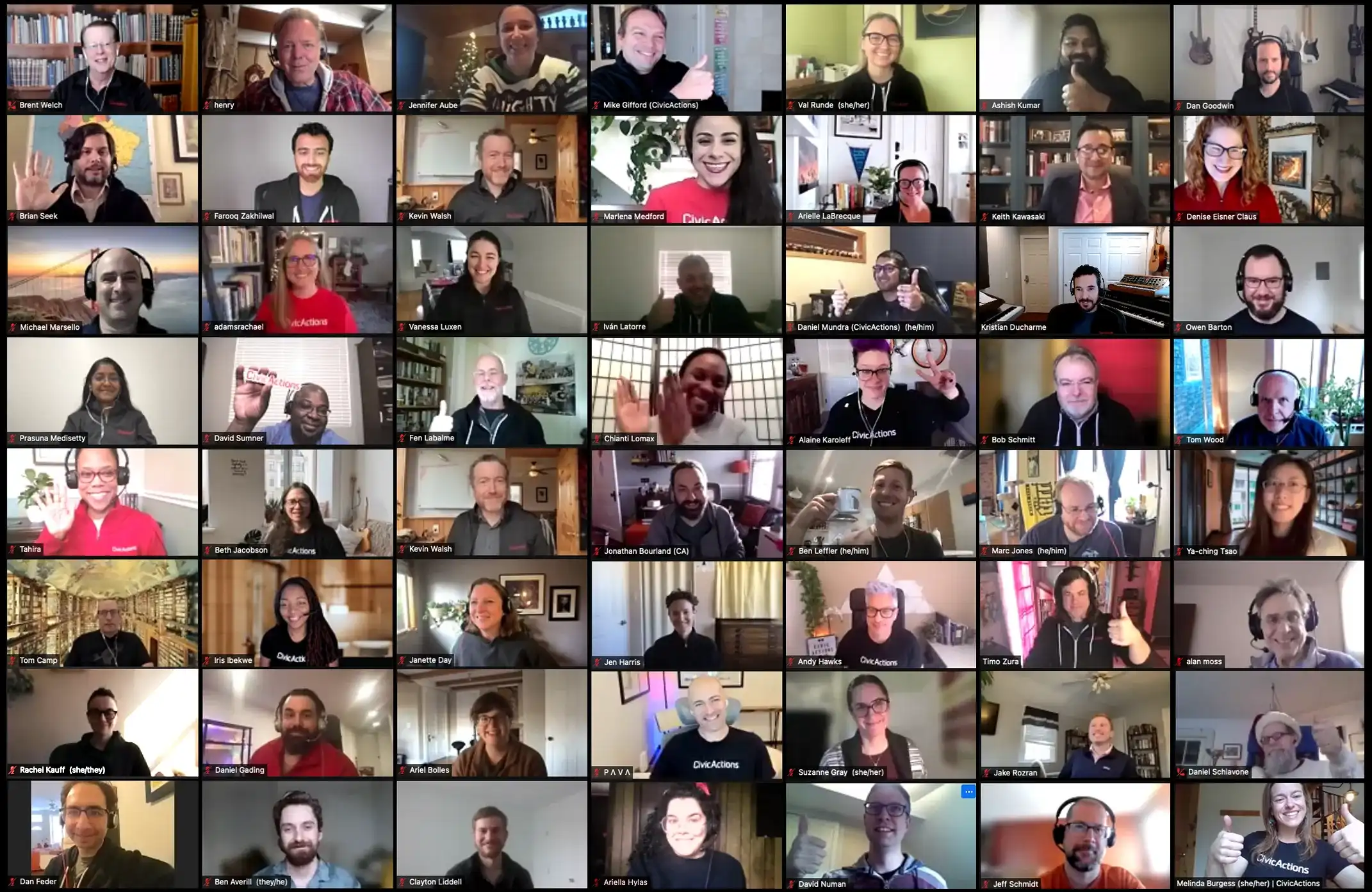 Large group of smiling CivicActions team members on a video call.